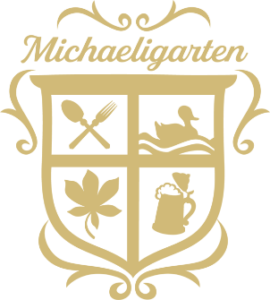 Goldenes Logo der Gastronomie Michaeligarten München.