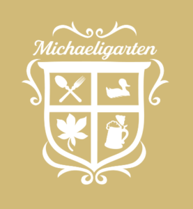 Weißes Logo auf goldenem Hintergrund der Gastronomie Michaeligarten München.